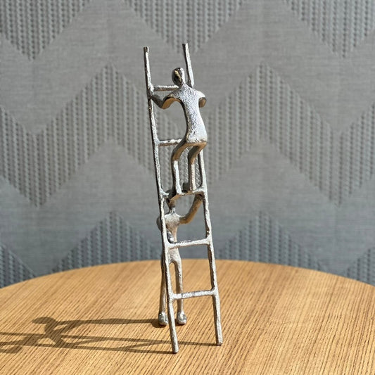 SILVER MAN WITH LADDER